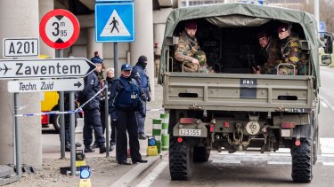 Belgian police and soldiers secure the area outside Zaventem Airport in Brussels on Tuesday.
