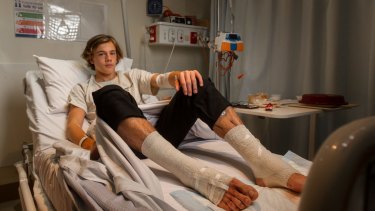 Sam Kanizay rests in hospital after being bitten while soaking his legs after a footy match.
