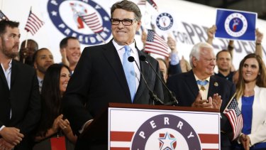 Former Texas governor Rick Perry smiles after announcing in Dallas, Texas, that he will run for president.