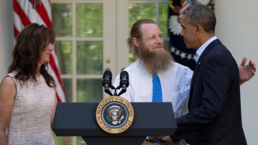 Bowe Bergdahl's parents Jani and Bob are congratulated by US President Barack Obama in the White House Rose Garden after he announced the deal to secure their son's freedom in May 2014.