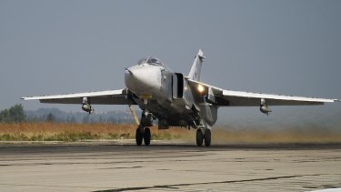 A Russian Su-24 takes off on a combat mission at Hemeimeem airbase in Syria in October.
