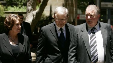 Then Prime Minister Kevin Rudd walks with Marjorie and John Worsley following the funeral for their son Luke in 2007.