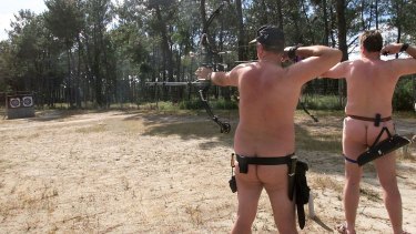 Nudists in Europe try a spot of beach archery.
