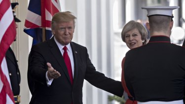 Donald Trump, left, welcomes Theresa May to the West Wing of the White House.