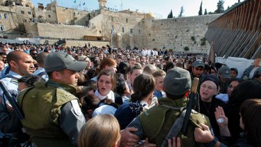 Israeli police attempt to keep order as Orthodox women and girls block members of Women of the Wall from praying at the site in 2013.