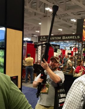 A man holds a massive gun at the annual NRA show in Nashville in April.