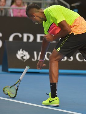 Nick Kyrgios smashes his racquet in frustration during his match against Italian Andreas Seppi.