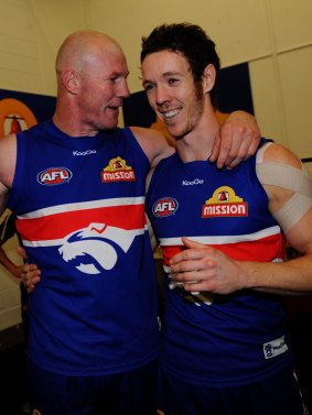 Barry Hall and Bob Murphy savour the taste of a finals victory in 2010.
