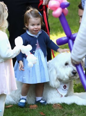 Princess Charlotte plays with a dog named Moose.