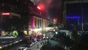 Gunshots and explosions rang out early Friday at a mall, casino and hotel complex near Manila's international airport in the Philippine capital, sparking a security alarm.