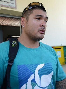 Michael Chan (centre) visits his brother Andrew Chan inside Kerobokan prison in Denpasar, Bali.