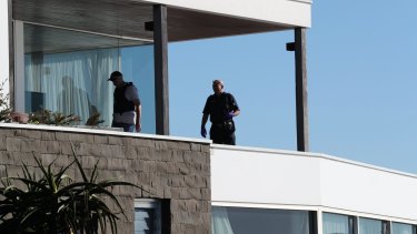 Police search John Ibrahim's clifftop home in Dover Heights.