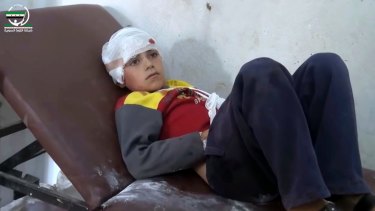 A child rests in hospital after being treated for wounds that independent observers say may have been the result of Syria-Russia coalition air strikes on the northern rebel-held village of Hass.