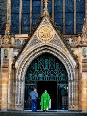 A priest at St Patrick's Cathedral on Sunday.