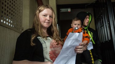 Waterloo resident Tara Wallis, her partner Jed Jackson and 19-month-old son Malakye Jackson. Ms Wallis is keen to stay, particularly in better housing.