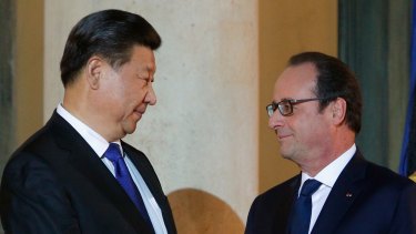 France's President Francois Hollande welcomes Chinese President Xi Jinping to Paris for the COP21 climate summit in November.