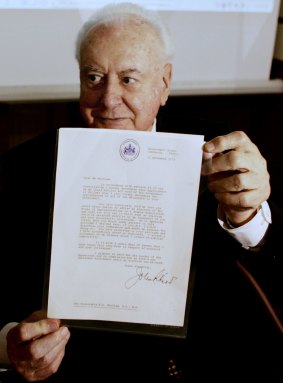 Former prime minister Gough Whitlam with the original copy of his dismissal letter he received from Sir John Kerr at a book launch in 2005.