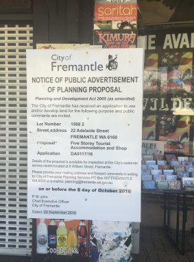 The development application plastered on Mills' front window.
