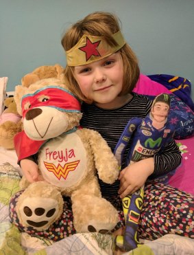 Canberra girl Freyja Christiansen in hospital in her Wonder Woman gear.