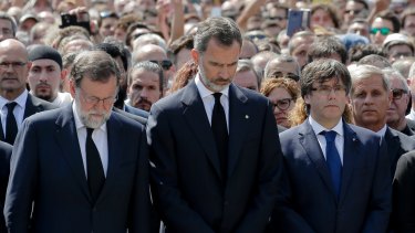Spanish Prime Minister Mariano Rajoy, King Felipe of Spain and Catalonia regional president Carles Puigdemont during a minute of silence in Barcelona on Friday.
