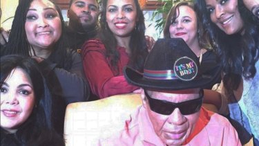 Ali poses with some of his seven daughters and two sons (above) at his most recent birthday party in January of this year. iNSTAGRAM