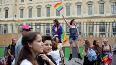 Revelers parade during the annual Gay Pride march in Paris, France in July.