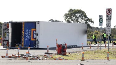 A truck driver has died in a head-on collision on the Hume Highway near Ingleburn. 