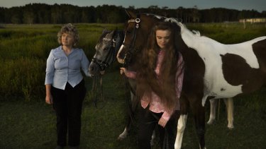 Kim-Leanne King, with her youngest daughter Madeline and their Appaloosa horses, worries she exposed her children to poison.