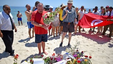 June 2015: Tourists pay tribute to 38 people killed at Marhaba beach in Sousse by a terrorist attack.