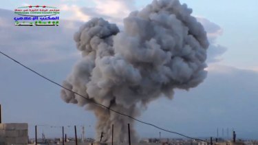 Image from video provided by Syrian activists shows smoke rising after a Russian airstrike in eastern Syria.