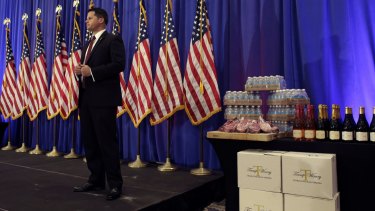 A secret service agent stands near some Trump wine. Trump's branded winery also received funds, according to statements.