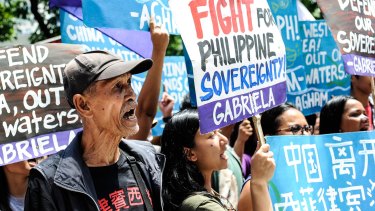 Anti-China protesters mount a rally against China's territorial claims in front of the Chinese Consulate in Makati, Philippines.