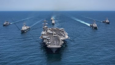 The aircraft carrier USS Carl Vinson, flanked by South Korean destroyers, with the USS Stethem, at the rear in May.