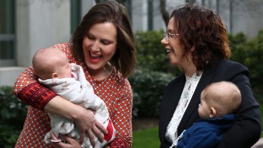 Kelly O'Dwyer with her daughter Olivia and Labor MP Amanda Rishworth with her son Percy.