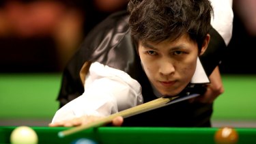 So close: Thepchaiya Un-Nooh plays a shot during his match against Australia's Neil Robertson during day seven of the UK Snooker Championship.