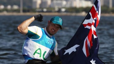 Tom Burton with an Australian flag after the win.