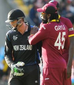 New Zealand's Martin Guptill is congratulated by West Indies opener Chris Gayle after he completed a double-century on Saturday. Gayle made the first double-century in the World Cup earlier in the tournament.