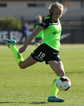 Nickoletta Flannery of Canberra United kicks the ball.