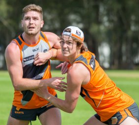 Jack Steele competes with Tomas Bugg during Giants' pre-season training.