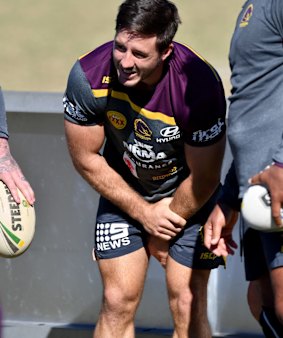 Ben Hunt clutches his arm at Broncos training.