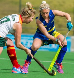 Naomi Evans, right, in action for Canberra against Tasmania.