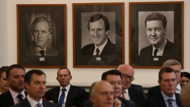 Former Liberal leader John Hewson (pictured centre) says Malcolm Turnbull needs to stand up to Tony Abbott in the party room.  