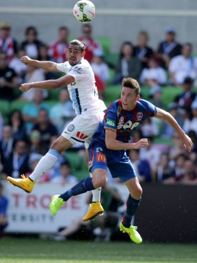 Melbourne CIty's David Williams and Newcastle's Scott Neville vie for the ball during Sunday's A-League encounter.