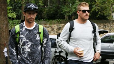 Matthew Wade, left, and Aaron Finch arrive at St Vincent's Hospital to visit cricketer Phillip Hughes on Thursday morning.