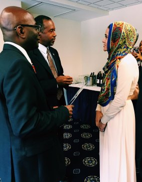 Rabiah Ahmed, right, communications director of the Muslim Public Affairs Council, hand delivers a letter to Republican presidential candidate Ben Carson in October 2015, inviting him to meet with members of the American Muslim community. The group sent letters to all the presidential candidates asking them to attend the organisation's public policy forum. The candidates either did not respond or declined, Ms Ahmed said.  