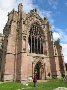 The rose-coloured exterior of Melrose Abbey. 