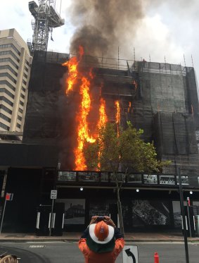 More than 60 firefighters battled the blaze at the building site in Circular Quay.