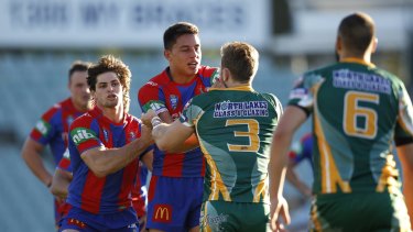 Spiteful clash: Newcastle's Joseph Tapine has words with Wyong opponent Nathan Stapleton. 