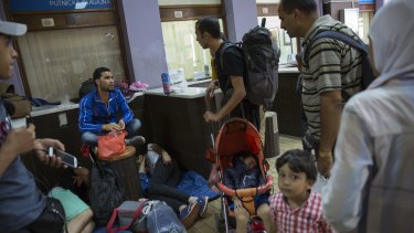 Migrant families gather in the main train station in Belgrade, Serbia. 