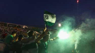 Fans pay tribute to the players of Brazilian team Chapecoense Real at the club's stadium in Chapeco on Wednesday.